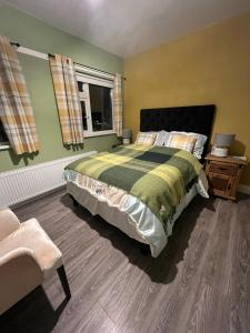 a bedroom with a large bed and a window at Pinebrook BnB En-suite 1 double bed in Killybegs