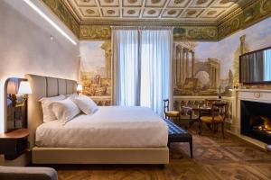 מיטה או מיטות בחדר ב-Duomo Luxury Florence