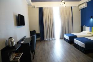 Postel nebo postele na pokoji v ubytování Hotel Panoramic