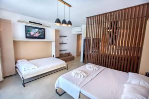 En eller flere senge i et værelse på Studio Panoramic Sea On + 28 billeder