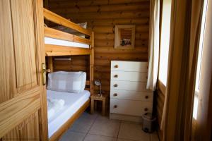 a small bedroom with a bunk bed and a dresser at Mallard Lodge in Selby