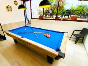 a pool table in a room with a pool table at Granada Hostel in Bogotá