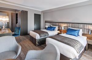 Postel nebo postele na pokoji v ubytování Hotel Agenda Louise