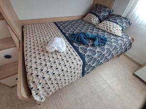 Postel nebo postele na pokoji v ubytování Résidence Maëlla