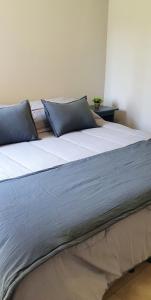 A bed or beds in a room at Buena vista PB - Bon Repos