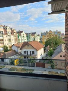 a view from a window of a city with buildings at Apartman Arija in Ruma