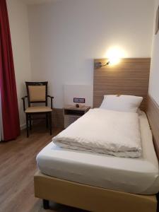 Postel nebo postele na pokoji v ubytování Hotel Mühleneck