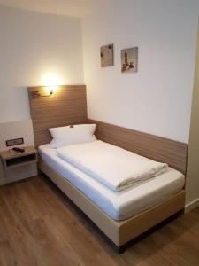 Postel nebo postele na pokoji v ubytování Hotel Mühleneck