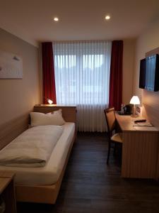 Postel nebo postele na pokoji v ubytování Hotel Mühleneck