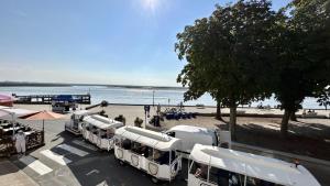 a row of buses parked next to a beach at L'Appart de nos 2 vies in Le Crotoy