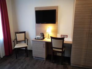 TV a/nebo společenská místnost v ubytování Hotel Mühleneck