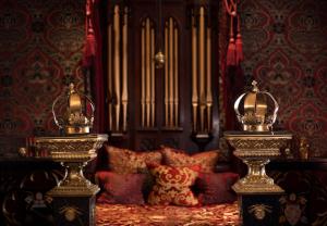 a room with a large organ and two vases in it at The Witchery by the Castle in Edinburgh
