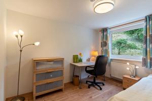 Postel nebo postele na pokoji v ubytování Haus Am Waldrand