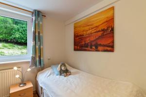 Postel nebo postele na pokoji v ubytování Haus Am Waldrand