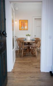 a dining room with a table and chairs at Bridge View in Annan