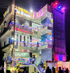 a building with christmas lights on the side of it at Hotel The Heaven in Muzaffarpur