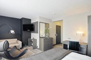TV a/nebo společenská místnost v ubytování Hotel Agenda Louise