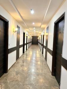 a corridor in a building with a hallway at JB Residency Zirakpur !! Top Rated & Most Awarded Property in Zirakpur in Zirakpur