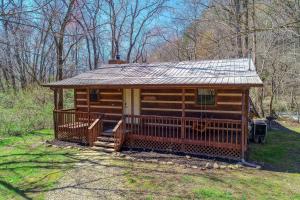 a cabin in the woods with a solar roof at Creekside Memories Cabin in Cosby