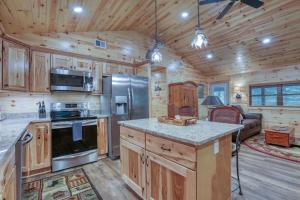 a kitchen with wooden cabinets and a stove top oven at Beside Still Water 2 - 2 Bedrooms, 2 Baths, Sleeps 6 home in Cosby