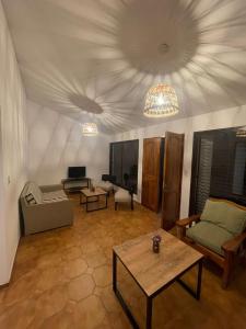 a living room with a couch and a table at Quinta Don Benito - Chacras de Coria- in Ciudad Lujan de Cuyo