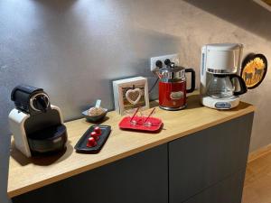 a counter with a coffee maker and a blender on it at Il Ciliegio Relax & Wellness in Druento