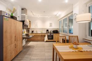 a kitchen with a table and a dining room at Stadt Land Fluss Plus in Arnsberg +16 photos