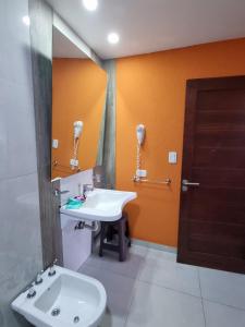 a bathroom with a sink and a mirror at View Beach in Villa Gesell +62 photos