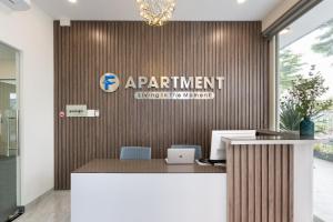 an office with a sign on a wall at F-APARTMENT in Ho Chi Minh City