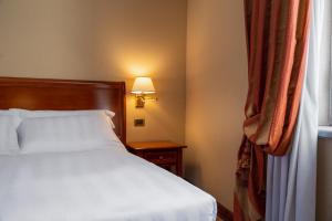 Postel nebo postele na pokoji v ubytování Hotel Oceania