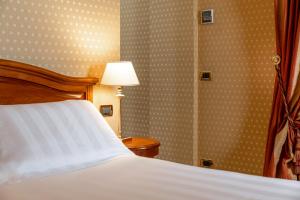 Postel nebo postele na pokoji v ubytování Hotel Oceania