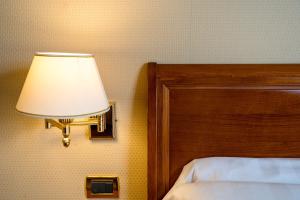 Postel nebo postele na pokoji v ubytování Hotel Oceania