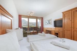 Voodi või voodid majutusasutuse Appartement Predigstuhlblick mit Indoorpool und Sauna toas
