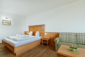 Postel nebo postele na pokoji v ubytování Appartement Predigstuhlblick mit Indoorpool und Sauna + 21 fotografií