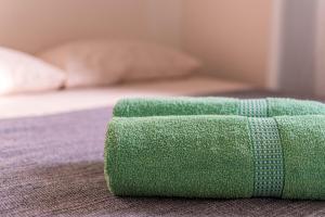 Ένα ή περισσότερα κρεβάτια σε δωμάτιο στο FLATS MAR'BELLA Ótima localizaçao com Varanda,100M Praia com Garagem Gratuito