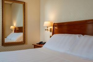 Postel nebo postele na pokoji v ubytování Hotel Oceania