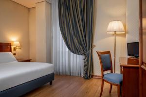 Postel nebo postele na pokoji v ubytování Hotel Oceania