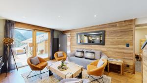 a living room with a couch and chairs at Nouveau ! Chalet pied des pistes in Champagny-en-Vanoise