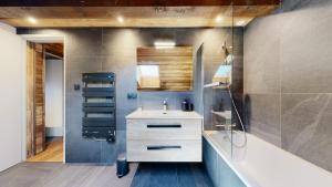 a bathroom with a sink and a bath tub and a sink at Nouveau ! Chalet pied des pistes in Champagny-en-Vanoise +21 photos