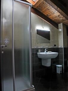a bathroom with a shower and a sink at RB Della Torre in Porretta Terme