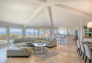 a living room with a couch and a table at 3906 Ocean's One Eleven home in Carmel