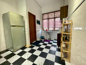 a kitchen with a refrigerator and a checkered floor at Home10#6pax#Netflix#NearAeonAlma&Lotus#BM# in Bukit Mertajam