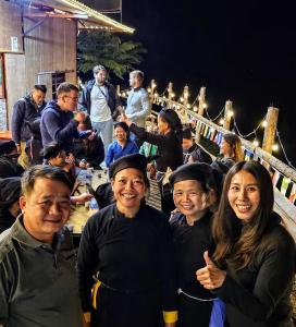 a group of people posing for a picture at Bao Lac Homestay Hostel & Coffee in Bảo Lạc
