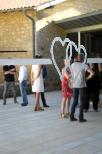 a group of people standing around with a heart sign at Le Moulin de Nouara in Ambert