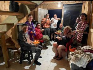 a group of people sitting in a room with food at Cabaña y temazcal Mastai in Jardin