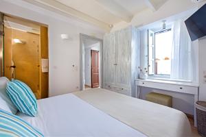 A bed or beds in a room at Lindos Allure Villa with Jacuzzi and Acropolis view!!!