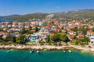 an aerial view of a town with boats in the water at House Villa Z&Z in Seget Vranjica