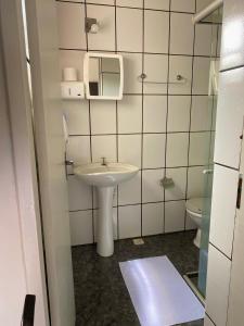 a bathroom with a sink and a toilet at Casa do Alferes in Ouro Preto +69 photos