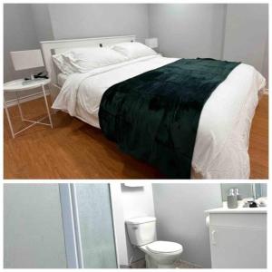 a white bedroom with a bed and a toilet at Charming Home in Prime Location North of Toronto in Richmond Hill