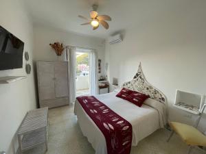Postel nebo postele na pokoji v ubytování Piccolo Hotel Luisa + 37 fotografií